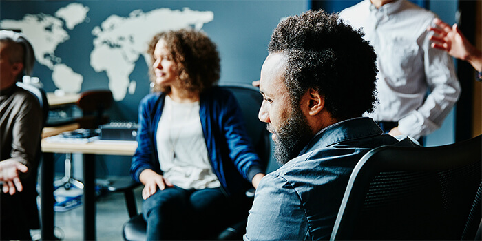 People in an office meeting room.